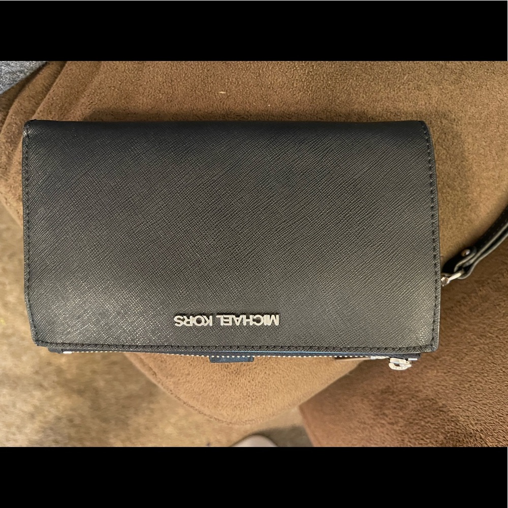 Almost New MK wallet/wristlet, used one time.